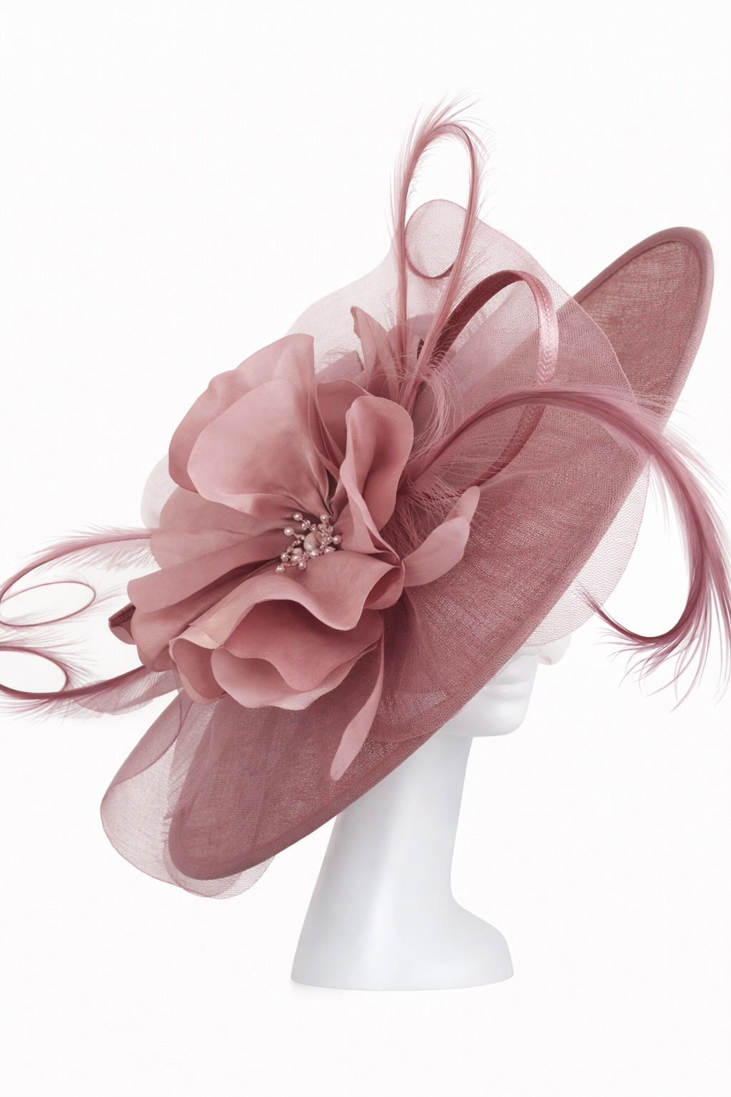 Pink floral hat on a white mannequin head against a white background