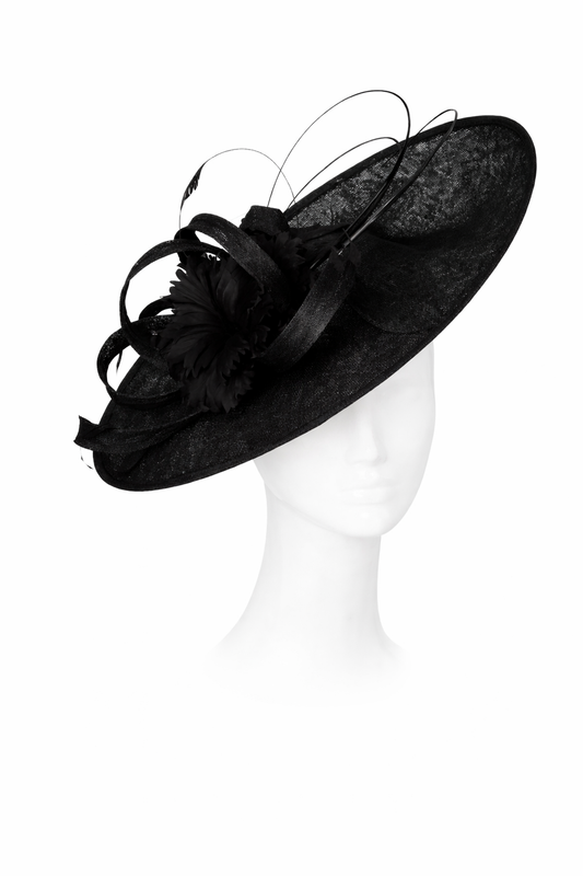 Black decorative hat on a mannequin head against a white background