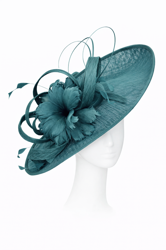 Teal decorative hat on a mannequin head against a white background